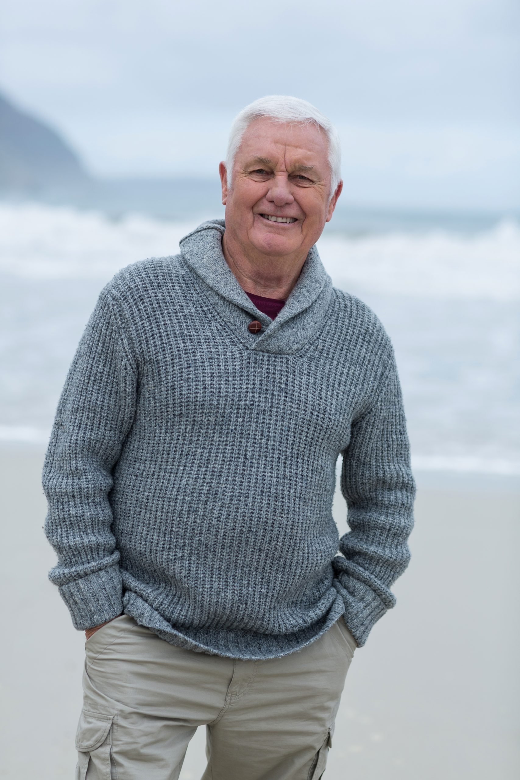 Portrait of senior man standing on the beach